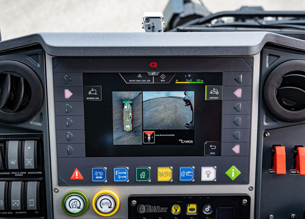 PANTHER cab: Central display with central function button with clear color assignment for operating safety in stressful situations